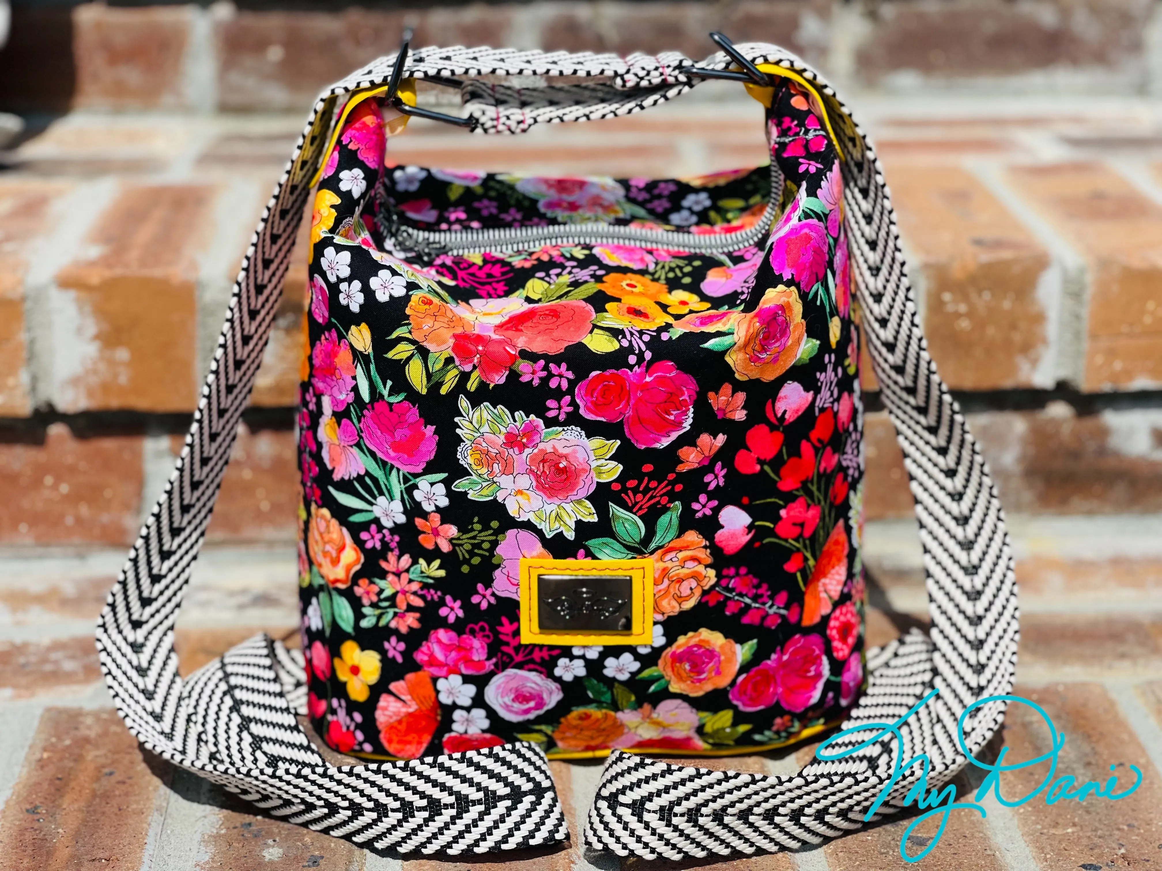 The Mini Krystal Convertible Handbag in Black Floral and Yellow Marine Vinyl