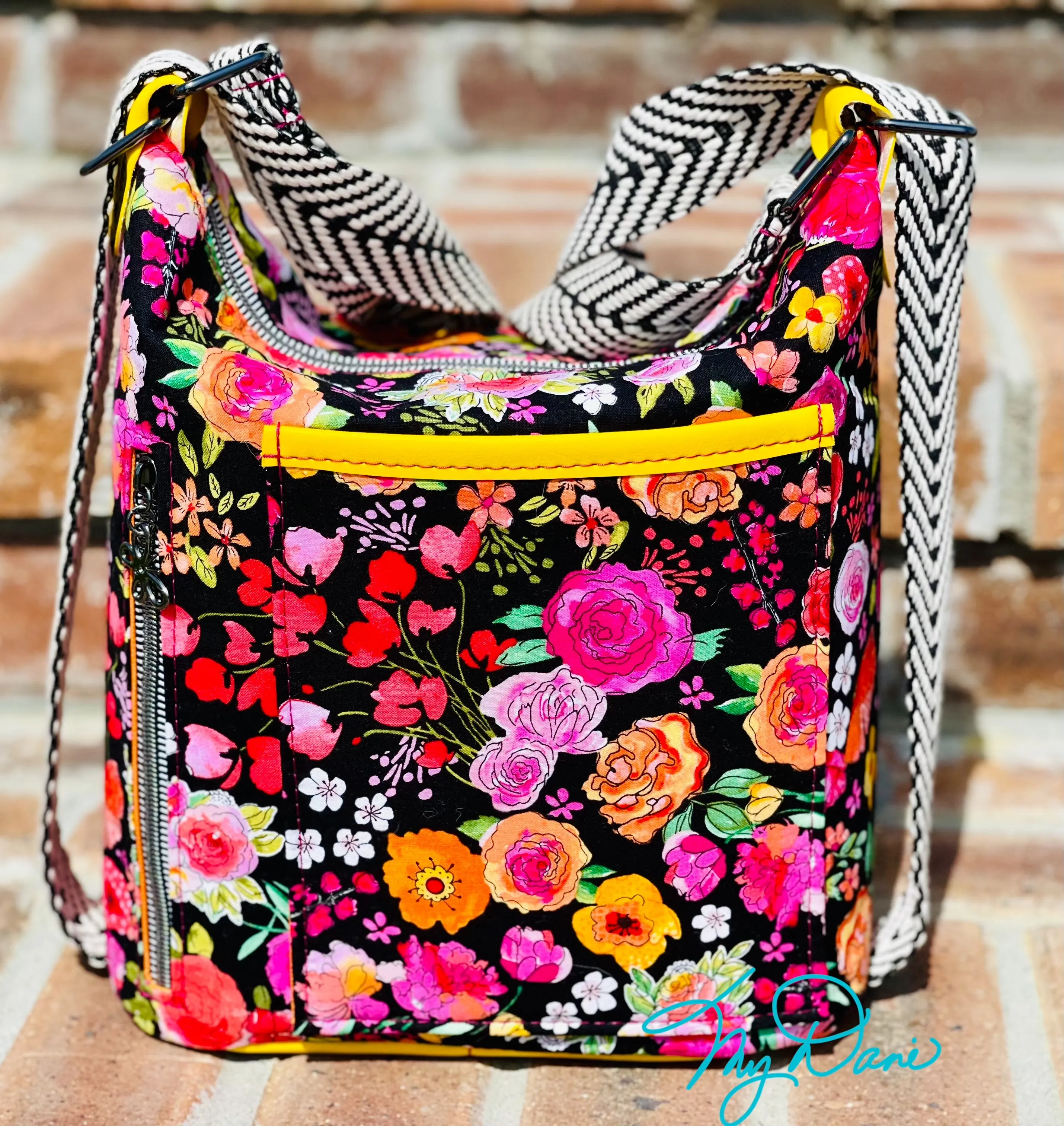 The Mini Krystal Convertible Handbag in Black Floral and Yellow Marine Vinyl