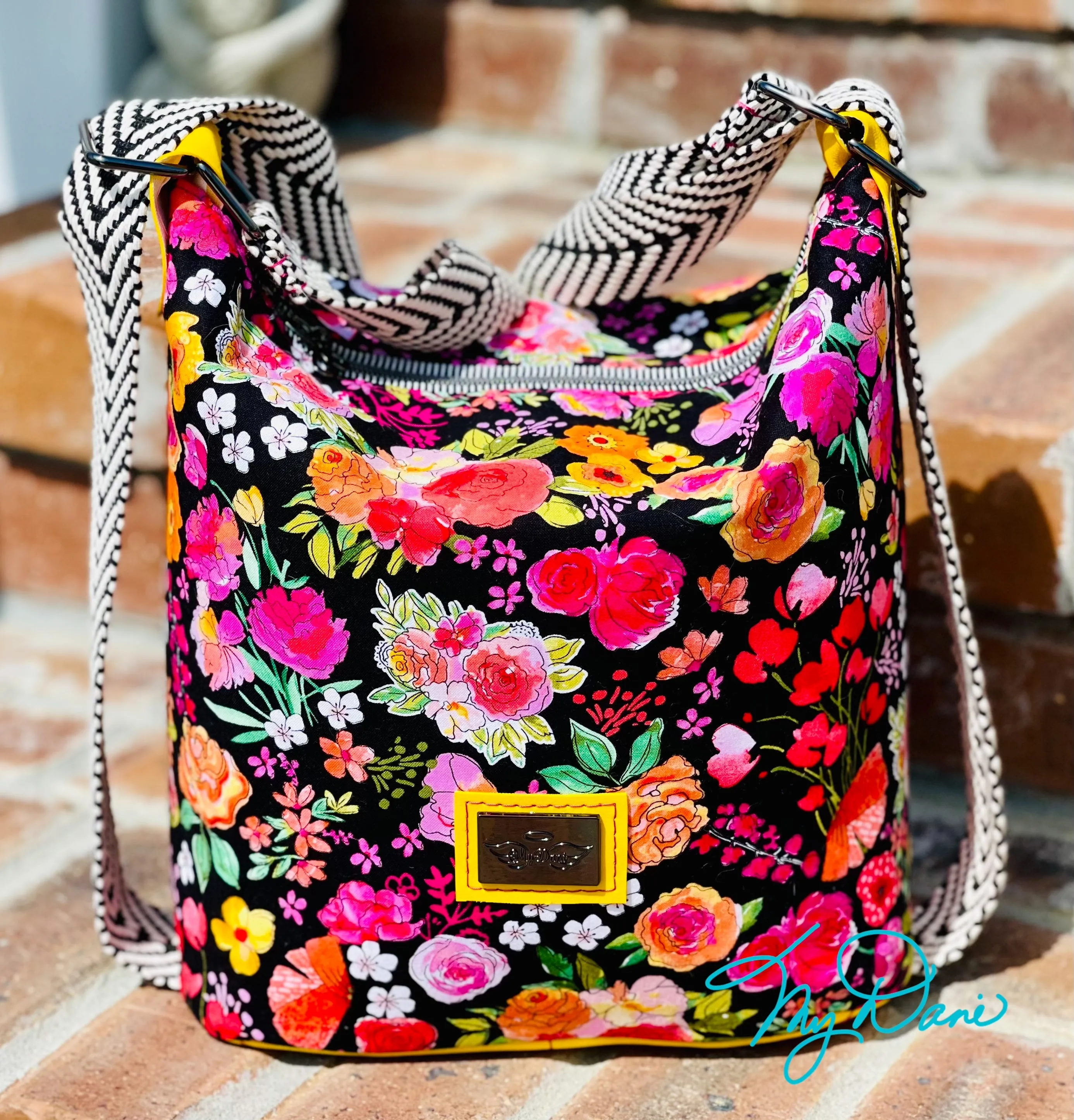 The Mini Krystal Convertible Handbag in Black Floral and Yellow Marine Vinyl